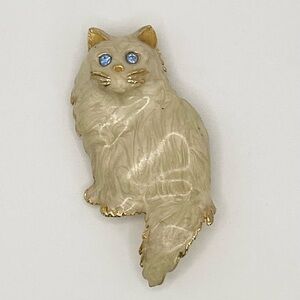 Vintage Cream Colored Gold Cat Brooch With Blue Gemstone Eyes
